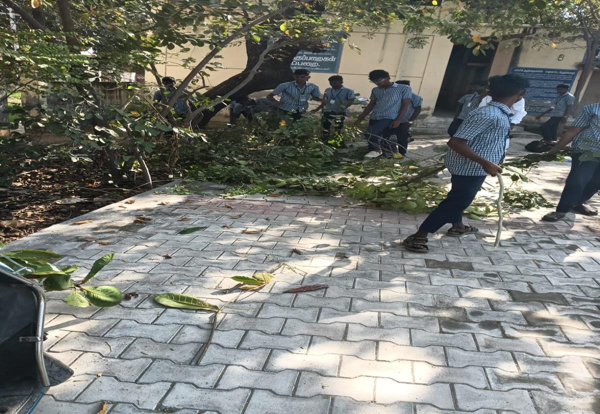 Youth volunteers clearing campus debris