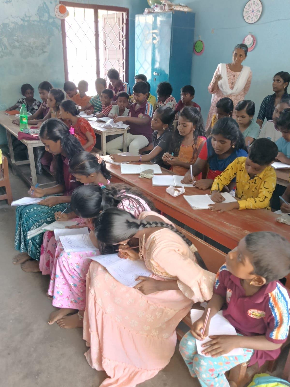 Children studying at community tuition