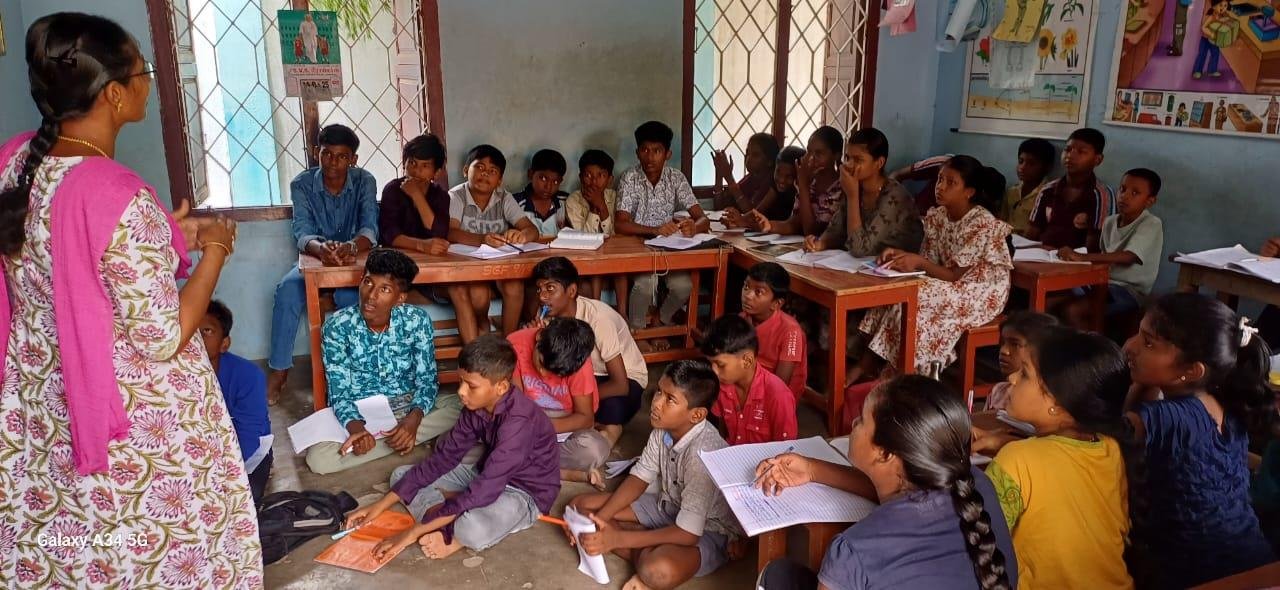 Volunteer teacher instructing tuition class
