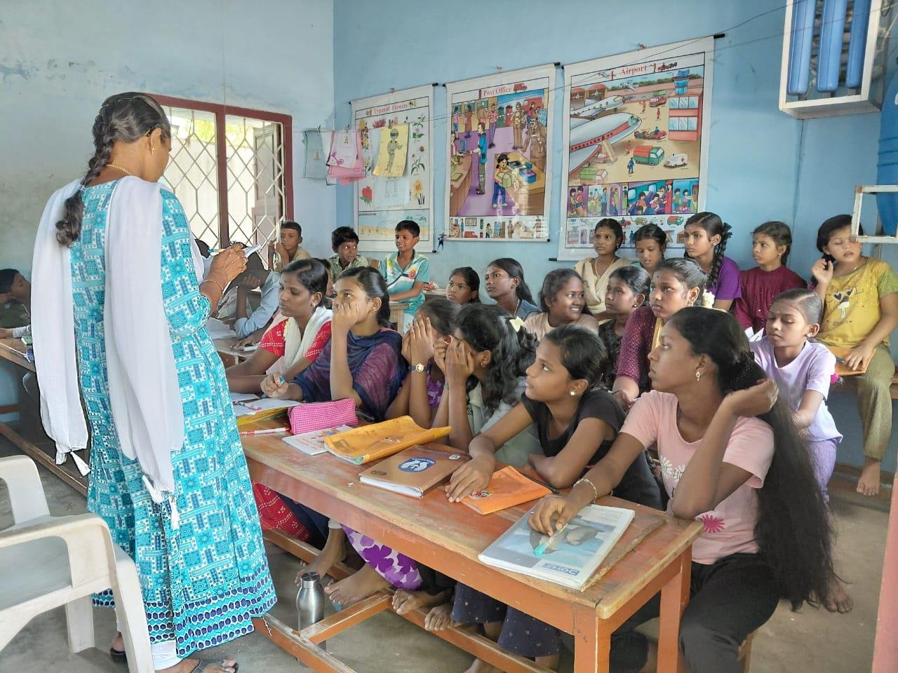 Instructor addressing attentive student class