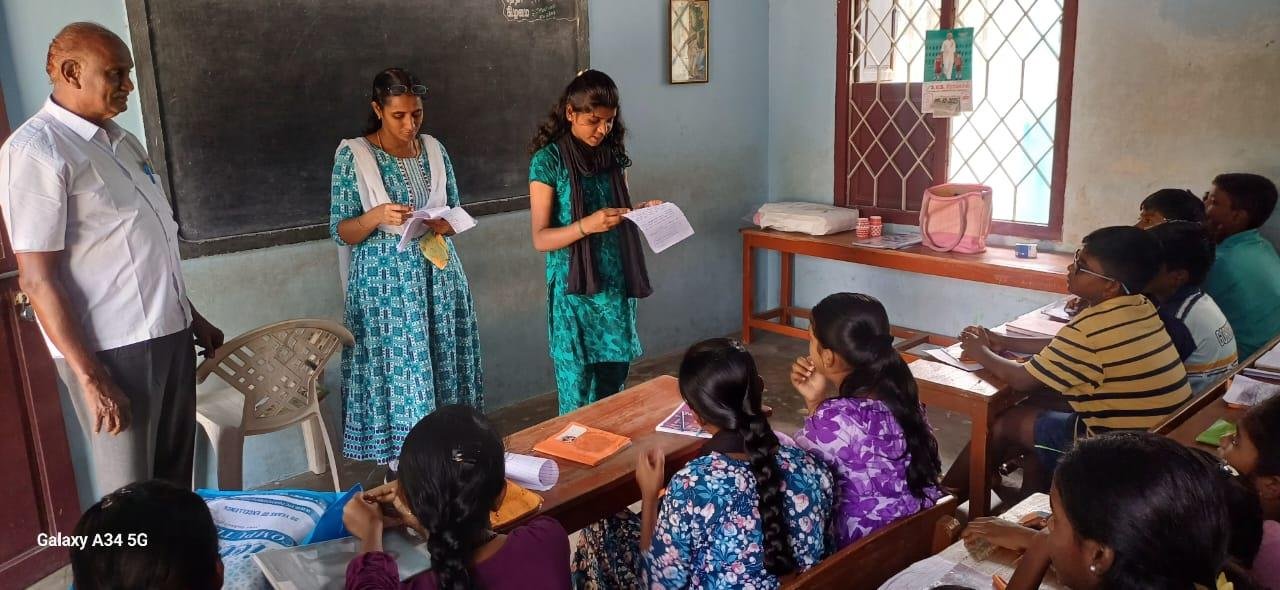 Guest speakers reading to schoolchildren