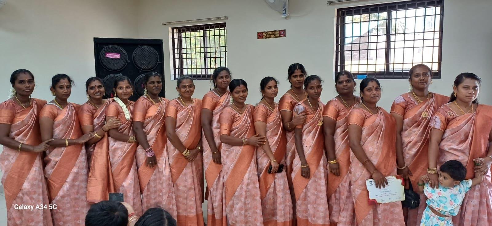 Women volunteers in matching sarees