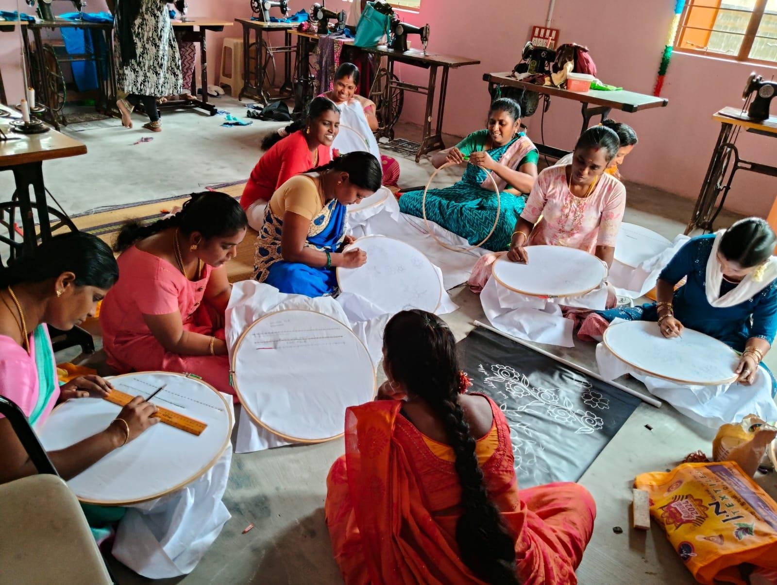 Women practicing embroidery in workshop